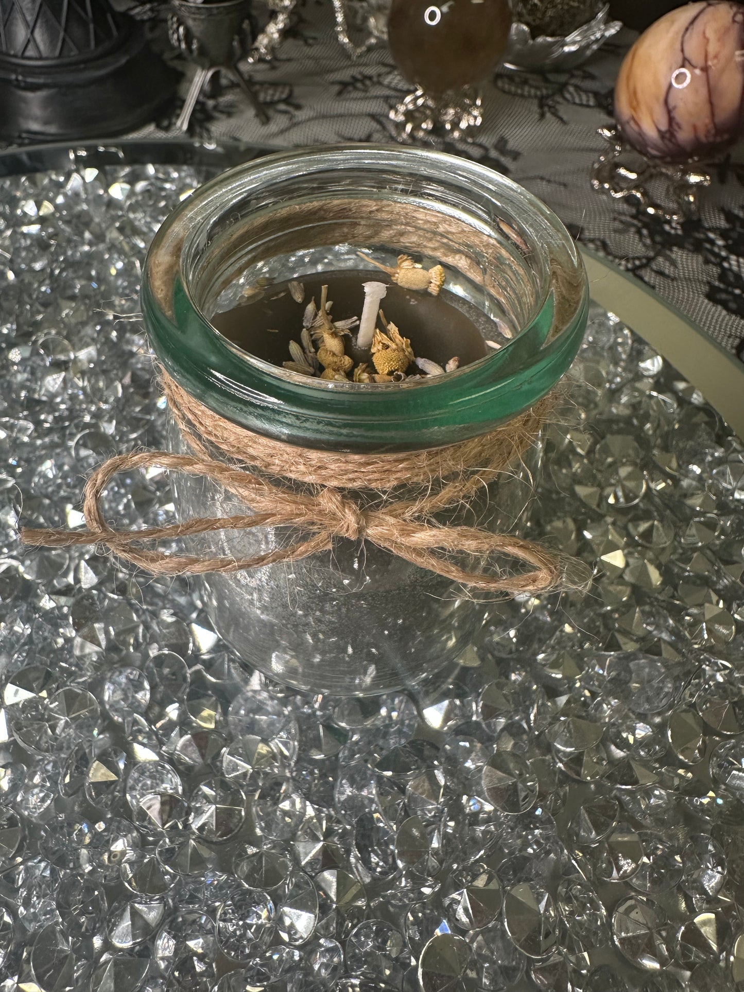 Hand poured/handmade, Pumpkin Vanilla Marshmallow scented protection candle infused with mica, sage and chamomile . Receive the Libra zodiac charm to win a 925 sterling ring!