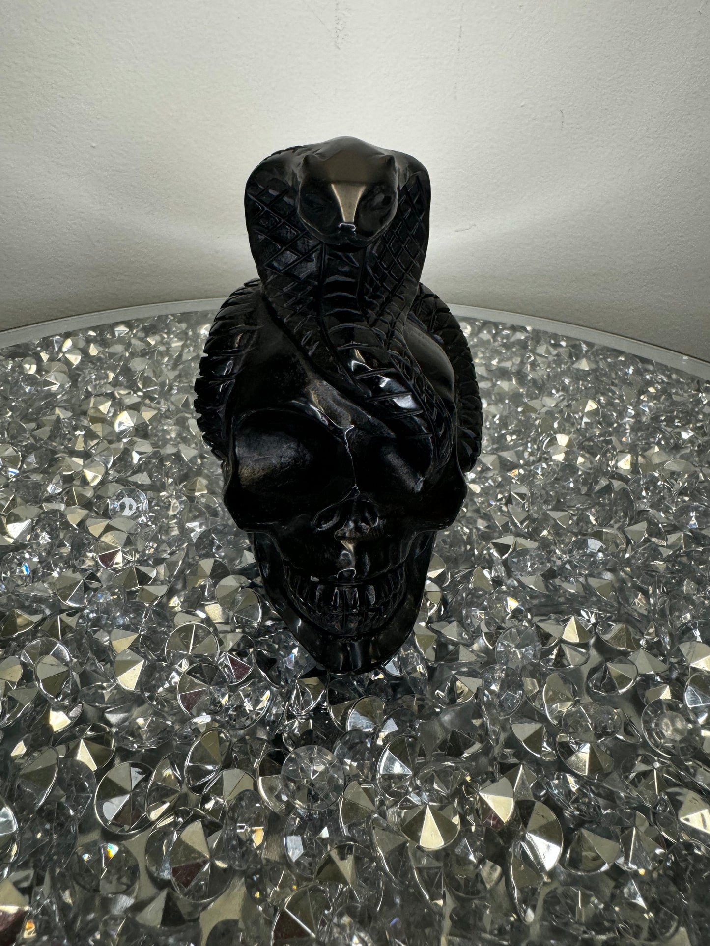 Black obsidian skull with cobra