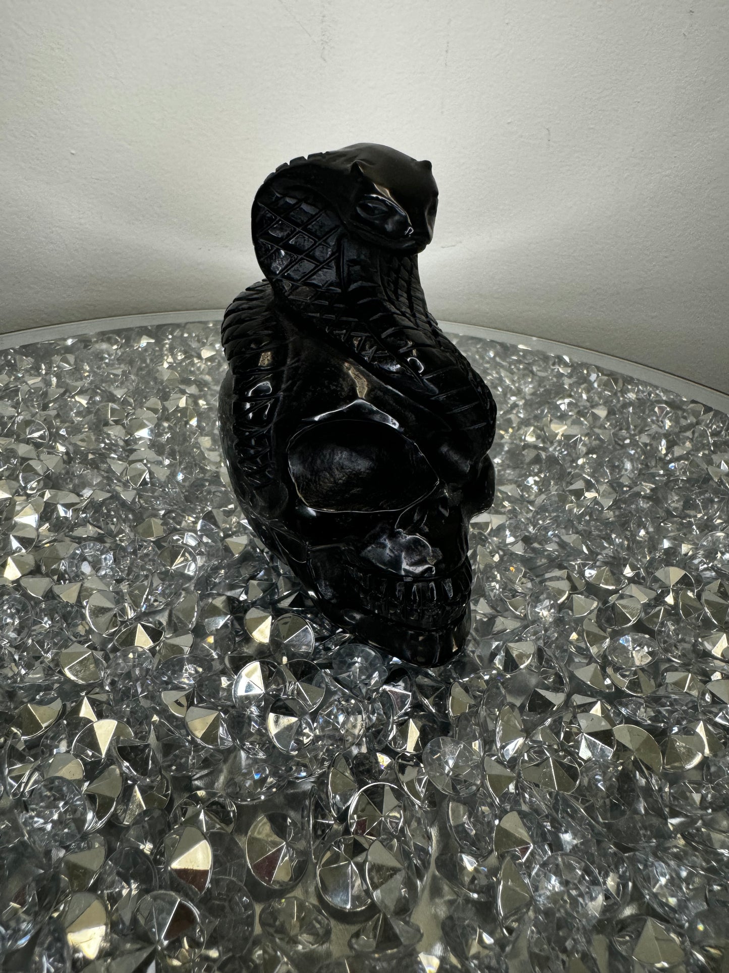 Black obsidian skull with cobra