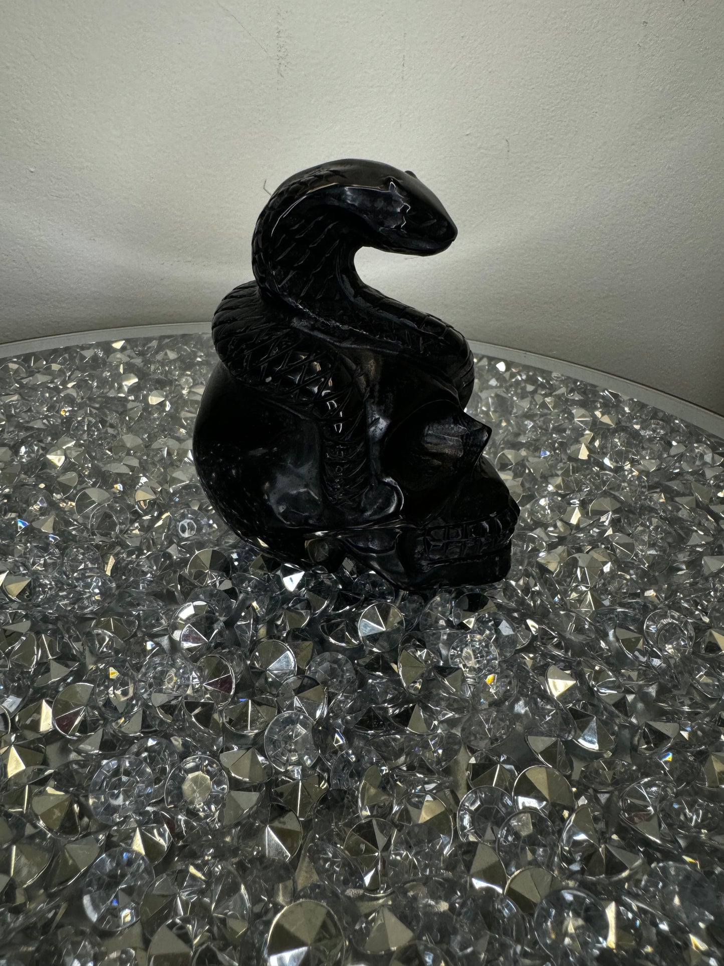 Black obsidian skull with cobra