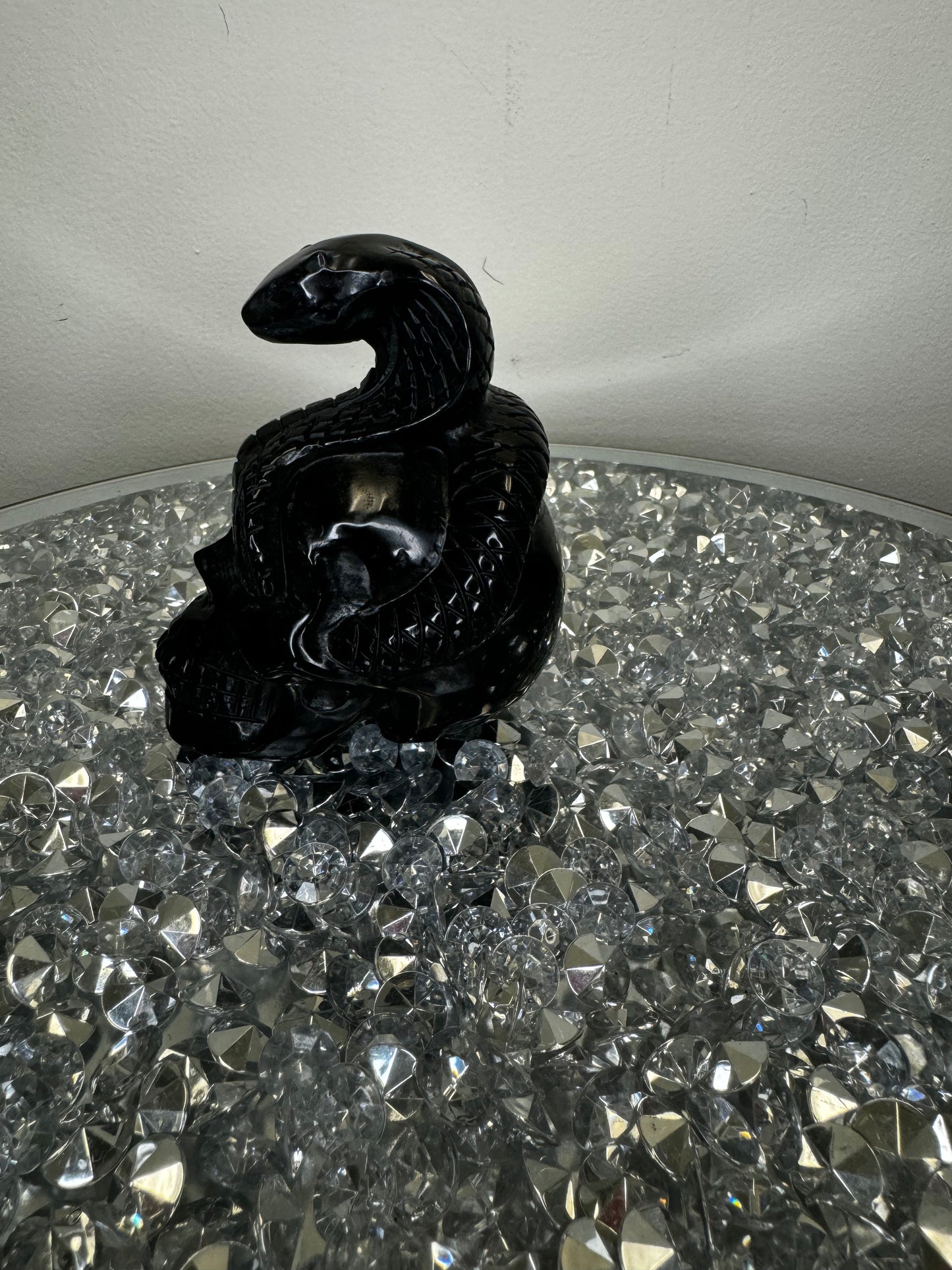 Black obsidian skull with cobra
