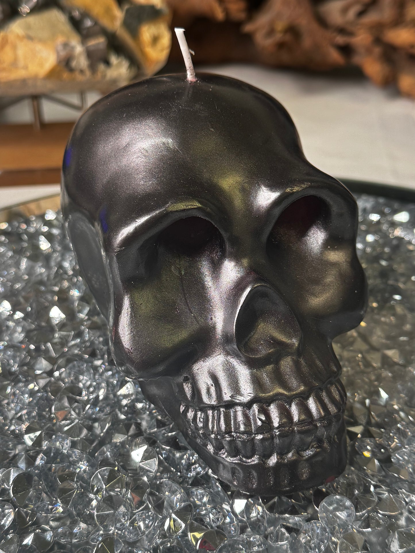 Black skull candle with red bleeding eyes